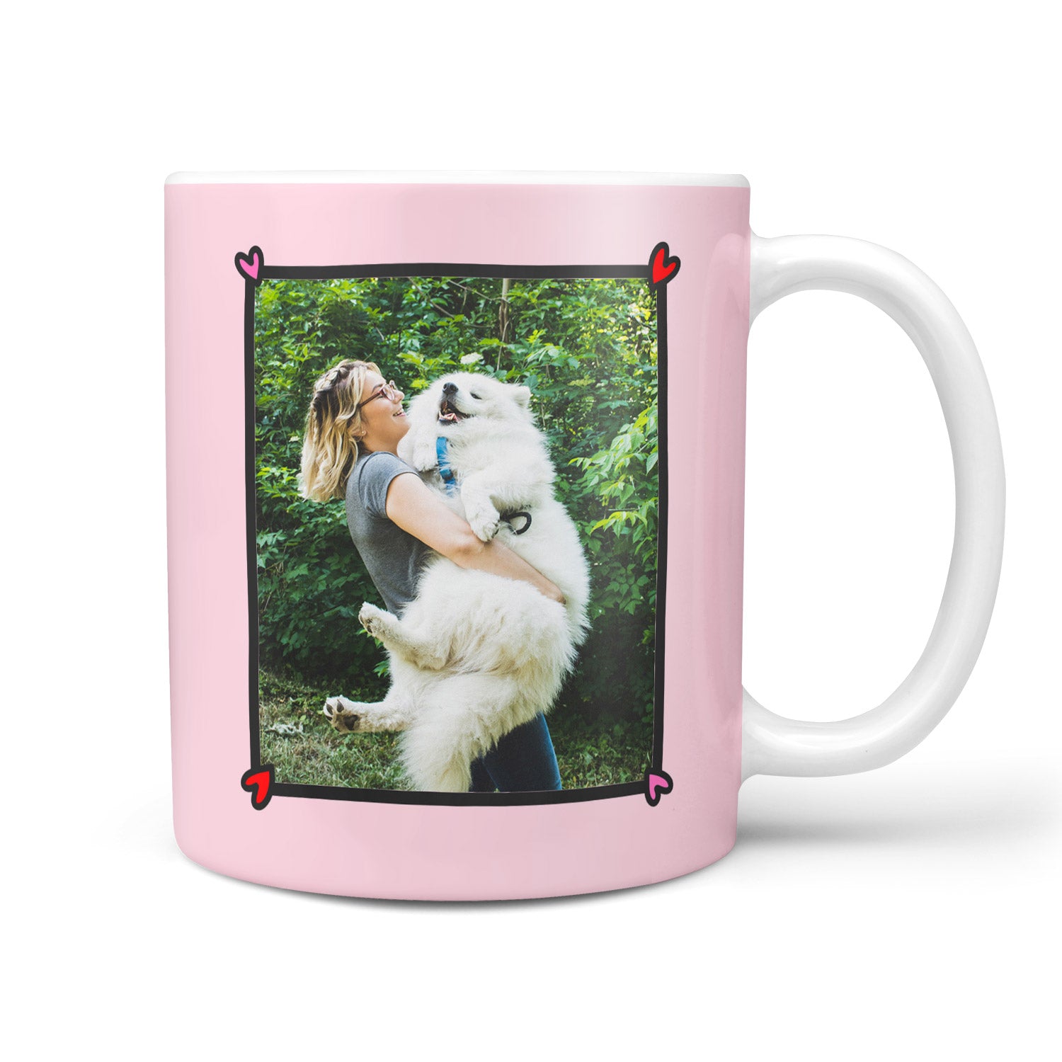 Pink mug with a photo of a woman holding a white dog on a pink background